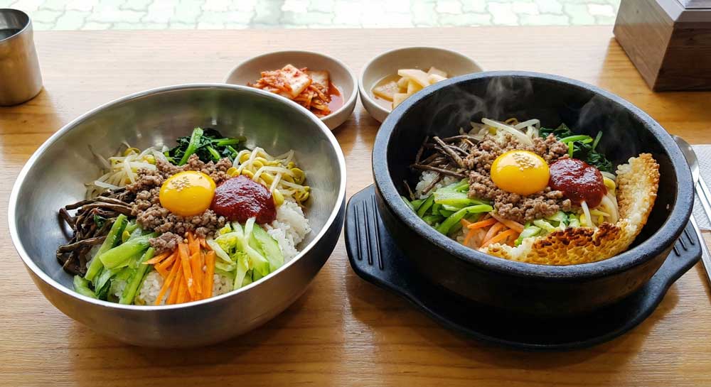 Side-by-side comparison of dolsot bibimbap and regular bibimbap
