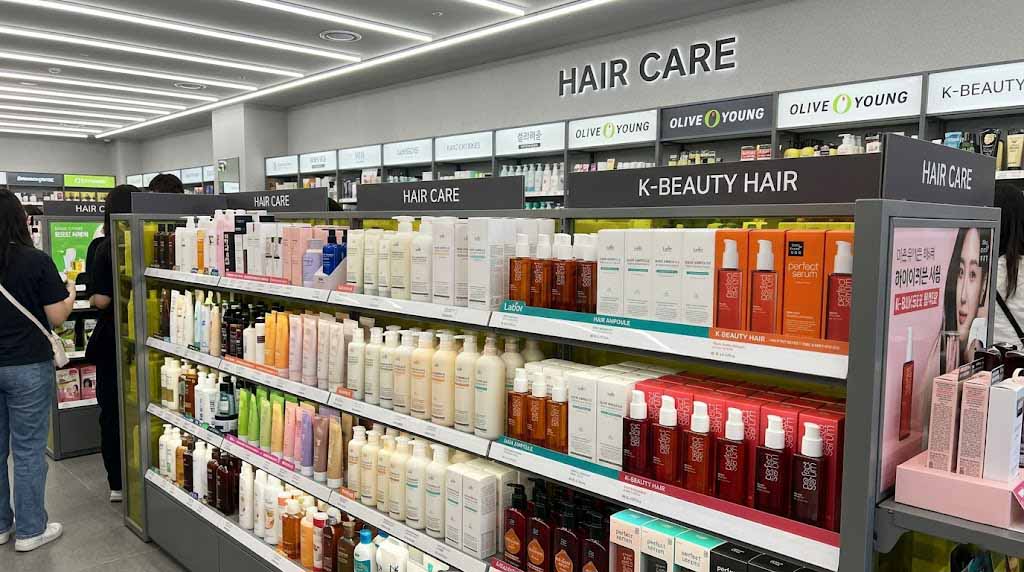 Korean hair care brand products including LADOR displayed on an Olive Young store shelf